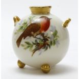 Royal Worcester hand painted spherical twin handled vase with the three gilt ball feet. Images