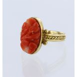 Yellow gold (tests 18ct) coral ring, floral carved coral measures 11.7mm x 6.7mm x 3.6mm, bezel