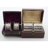 Two pairs of boxed napkin rings hallmarked J.M.B. Birm. 1884 and H.C.D. Birm. 1910 & 1912. Total