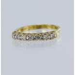 18ct yellow gold diamond half eternity ring, set with seven round brilliant cut diamonds, total