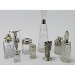 Silver. A group of various items, comprising two silver squat vases and seven bottles & jars with