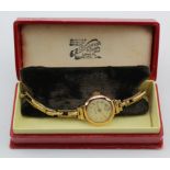 Ladies 9ct cased Helvetia wristwatch on a 9ct expandable strap. Watch working when catalogued. Total