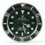 Advertising Wall Clock. Green 'Rolex' style advertising wall clock, black dial reads 'Rolex Oyster