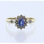 9ct yellow gold diamond and sapphire cluster ring, one oval mix cut sapphire measuring 5mm x 4mm,