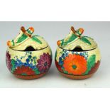 Clarice Cliff. Two Clarice Cliff 'Gayday' pattern preserve pots with lids, slight chipping to both