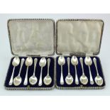 Two boxed sets of silver golf teaspoons (six in each box) all hallmarked for Walker & Hall,
