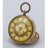 Ladies 9ct open face pocket watch. The gilt dial with foliate engraved decoration and black roman