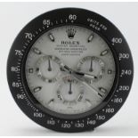 Advertising Wall Clock. Black & White 'Rolex' style advertising wall clock, black dial reads '