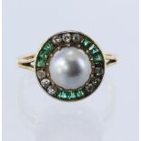 Yellow metal stamped '18ct' Art Deco target ring, principle 7.8mm cultured pearl in a claw setting