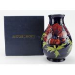 Moorcroft 'Anemone' colbalt blue vase signed WM to base. Boxed. 1st quality. Height 18cm approx.