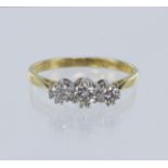 Yellow gold (tests 18ct) trilogy ring, set with three graduating round brilliant cut diamonds, total