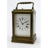 French brass chiming carriage clock, white enamel dial with Roman numerals, height 13.5cm approx. (