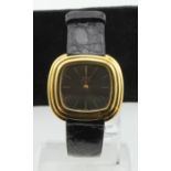 Ladies 18ct gold cased Piaget quartz wristwatch. The brown square dial with gilt baton markers, on a