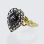 Yellow gold (tests 15ct) heart shaped cluster set with one cabochon heart shaped garnet measuring