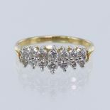 Yellow gold (tests 14ct) diamond set dress ring, set in two rows with a total of fourteen graduating