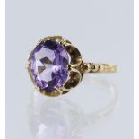 9ct yellow gold amethyst dress ring, set with one oval mixed cut amethyst measuring 10mm x 8mm,