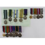 Miniature medals some mounted for wearing.