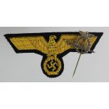 German Nazi U boat pin and cloth breast eagle.