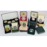 GB & World cased coins, set and medals (17 cases) including silver proofs; a few certs missing.