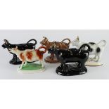 Cow Creamers. Five various cow creamers, one missing lid, tallest 13cm approx.