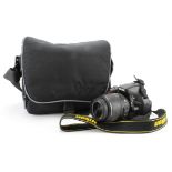 Nikon D5200 camera with 18-55mm AF-S DX Nikkor lens, in a Nikon case with some accessories and