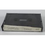 Beatles interest. A cassette tape containing Beatles demo recordings for Fool on the Hill, I am