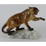 Beswick porcelain figure, depicting a panther on a rock (no. 1702), makers impressed mark to base,