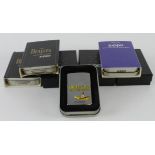 Zippo. A group of seven cased Beatles themed Zippo lighters
