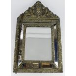 Mirror. An unusual ornately decorated brass five pane mirror, height 55cm, width 33cm approx. (in