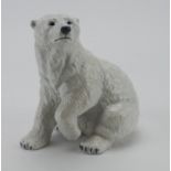 Royal Copenhagen porcelain figure, depicting a seated polar bear (no. 355), makers marks to base,