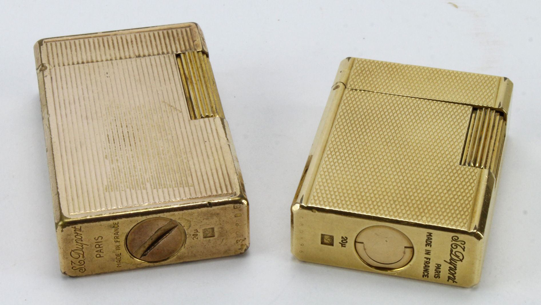 Dupont. Two ST Dupont gold plated lighters