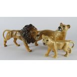 Beswick. Three Beswick porcelain figures, depicting a a lion & ywo lionesses, makers stamp to