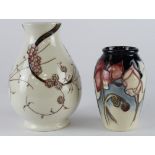 Moorcroft. Two Moorcroft vases with floral decoration, circa 2000s, height 13.5cm & 10.5cm approx.