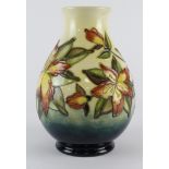 Moorcroft vase with floral decoration, makers mark to base, height 19cm approx.