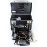 Singer 222K electric sewing machine, with pedal and accessories, contained in original black case (