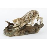 Beswick porcelain figure (matt), depicting a cheetah on a rock (no. 2715), makers mark to base,