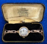 Ladies Gold Watch, Bravington's 9ct watch, engine turned face, Roman numerals and seconds dial