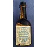 Beer label on bottle, a small glass bottle (just under 7cm high) with a vertical rectangular