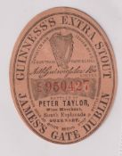 Beer label, Guinness's Extra Stout, a rare vertical oval label bottled by Peter Taylor, Guernsey,