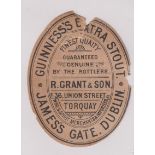 Beer label, Guinness's Extra Stout, a rare c1896 vertical oval bottled by R Grant & Son, Torquay,