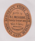 Beer label, Guinness's Extra Stout, bottled by R C Musgrave, Teignmouth, rare c1896 vertical oval,