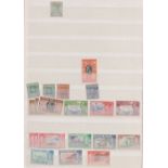 Stamps, World collection in 12 albums/stockbooks to include Cayman Islands, Gambia, Mauritius and