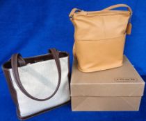 Coach, 2 bucket handbags in unused condition, one tan leather and one canvas with chocolate