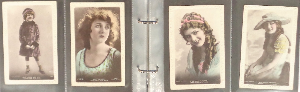 Postcards, Cinema, a collection in modern album of 115 mainly pre WW2 coloured RPs of female - Image 2 of 3