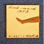Copper Bookmark, with contemporary MS 'Book-mark 1858', pointing hand on one side and leg the other,
