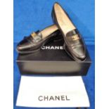 Chanel black leather loafers size 37.5 with protective shoe bag and box. Some very light wear (vg)