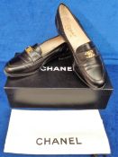 Chanel black leather loafers size 37.5 with protective shoe bag and box. Some very light wear (vg)