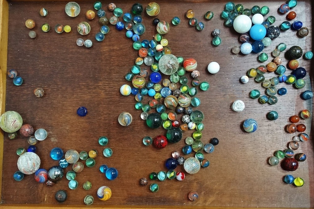 A collection of Victorian and later glass marbles.