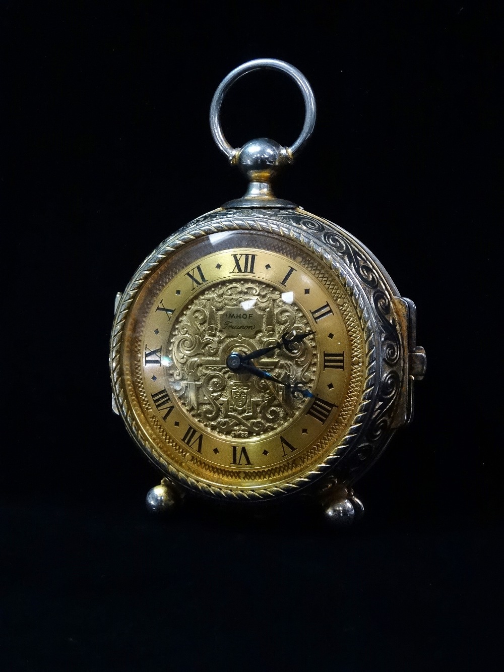 An Imhof Trianon Swiss 15 jewel eight day travelling alarm clock, in the form of an 18th century