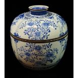A 20th century Japanese blue and white porcelain jar and cover, with metal mounts and painted with